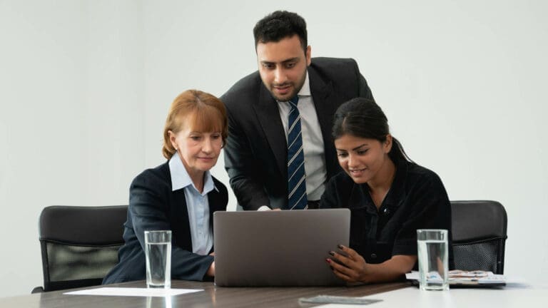 Team looking at laptop